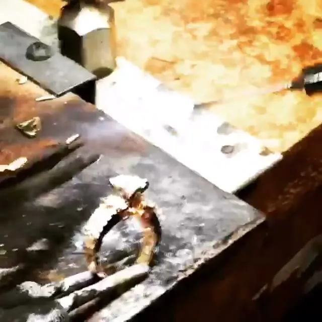 A torch at Mehran’s bench, on a ring with side stones